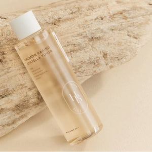 Heveblue Salmon Caring Centella Toner bottle with pink-toned liquid
Korean toner for sensitive skin with centella, salmon PDRN, and hyaluronic acid
Close-up of pH 5.5 salmon soothing toner for moisture barrier care
Lightweight hydrating toner texture on palm for dry or irritated skin
