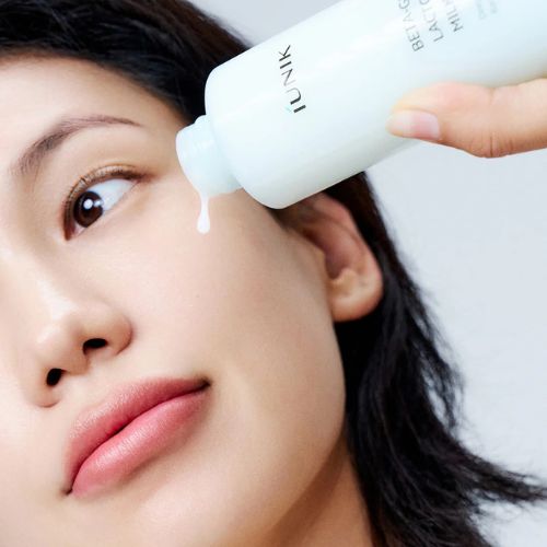 iUNIK Beta Glucan Lacto Barrier Milk Essence bottle packaging
milky essence texture close-up on skin
probiotic hydration essence for sensitive skin
Korean skincare product display at Crescite Beauty UAE